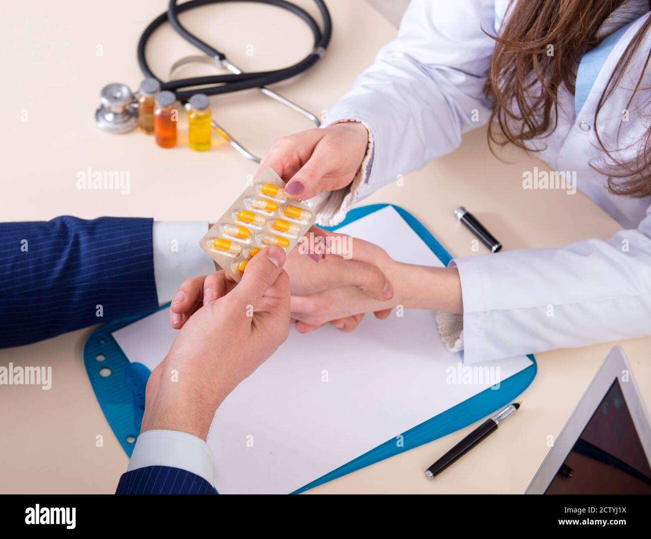 The man visiting doctor for routine check-up Stock Photo - Alamy