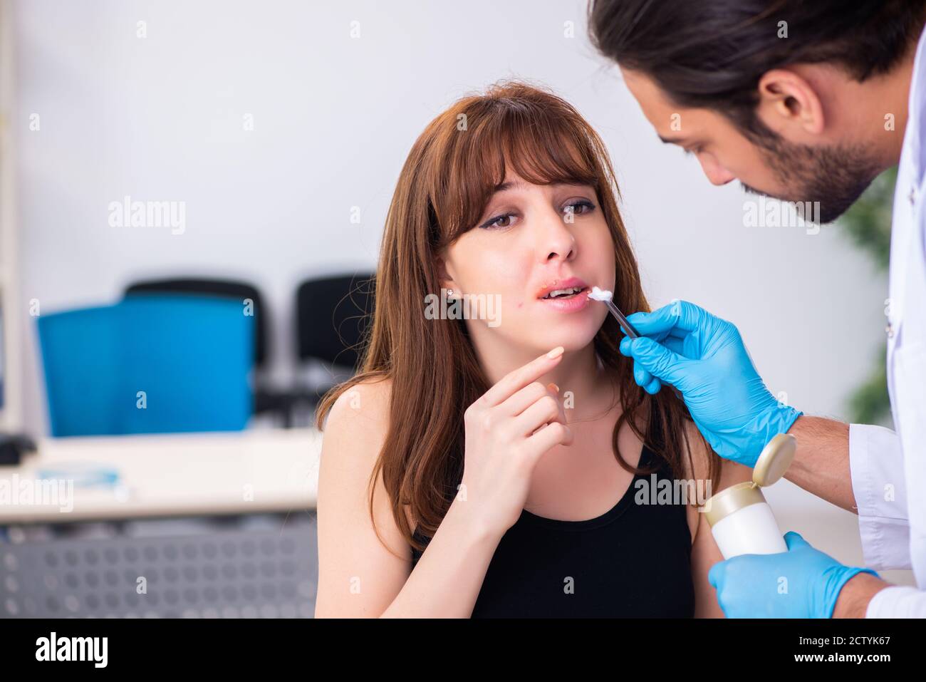 Young woman visiting doctor dermatologist Stock Photo Alamy