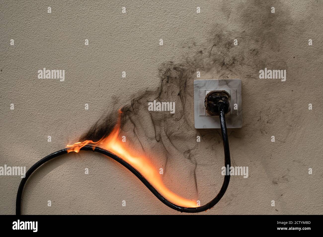 On fire electric wire plug Receptacle on the concrete wall exposed