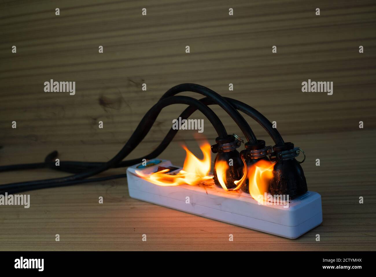 On fire multi socket with the connected power strip with a bunch of