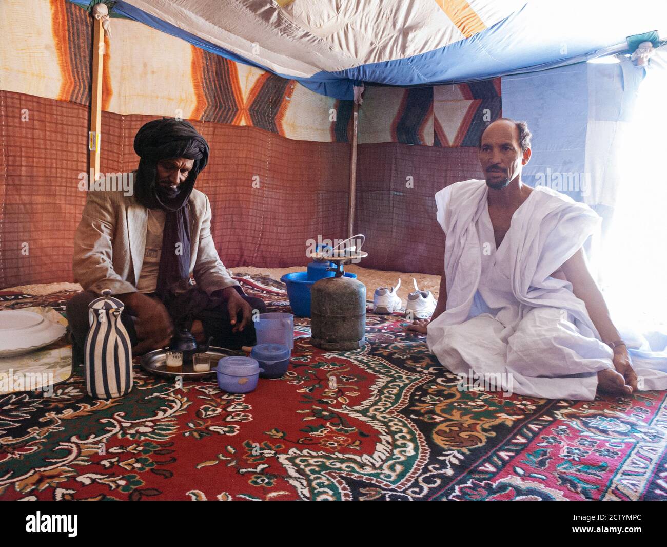 Berber man preparing mint tea in the Sahara desert in Mauritania Stock