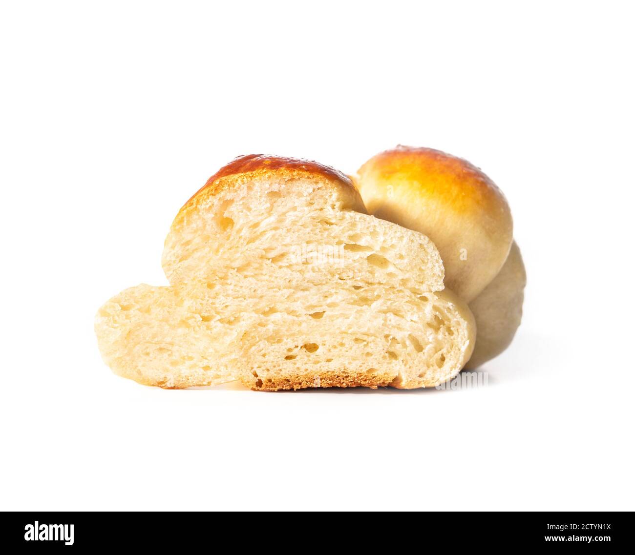 Soft fluffy of yeast bread cut in half. Concept for traditional breakfast table. Authentic Swiss butter bread recipe called Zopf or Butterzopf, or or Stock Photo