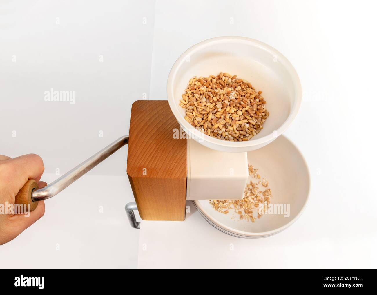 Grain roller or grain flaker. Used to make natural rolled oats. Hooper