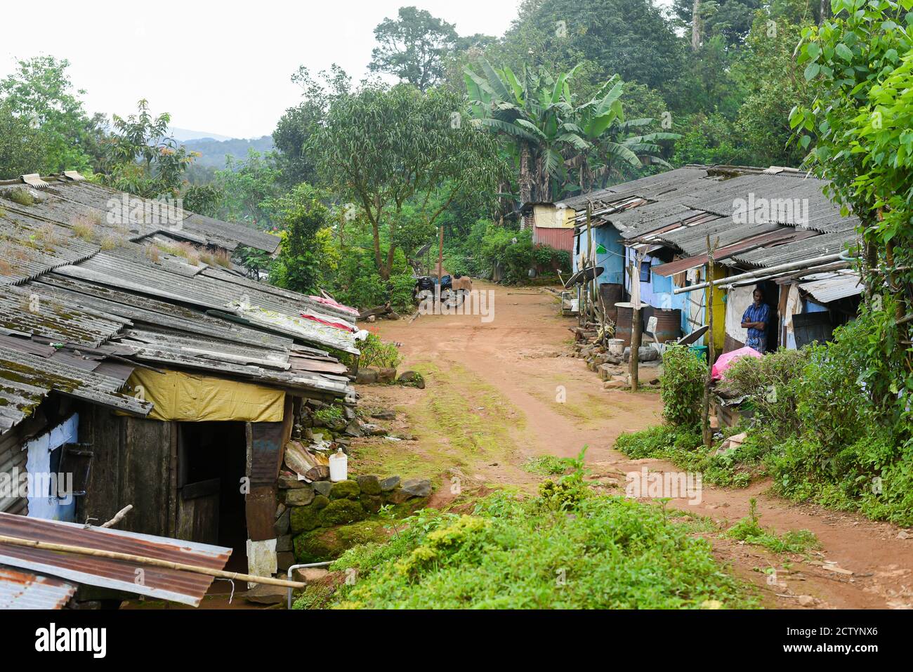 A rural house made of bricks and mud in India with many people living together. India Kerala Tamil Nadu  street life photography. Stock Photo