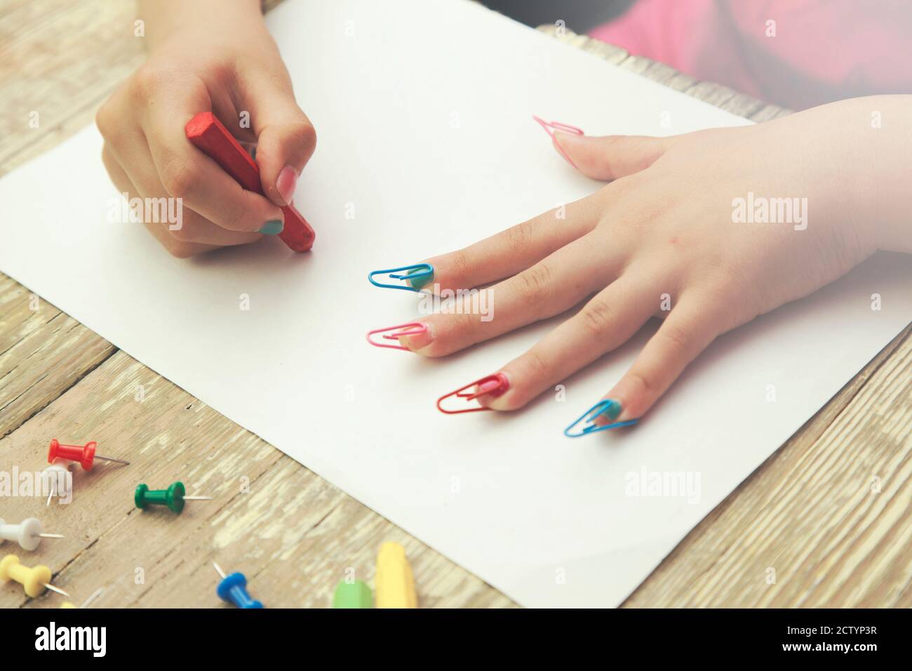 Little girl hand colored pencils and stationery Stock Photo Alamy