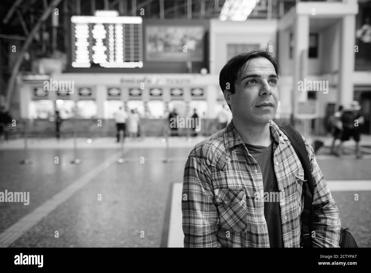 Portrait of handsome Persian tourist man at the railway station Stock Photo