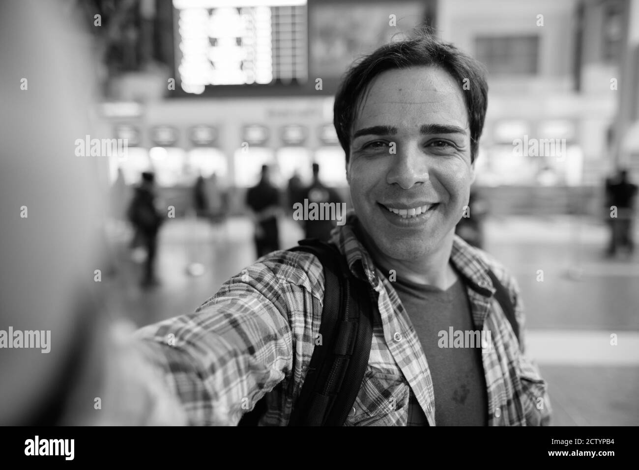 Portrait of handsome Persian tourist man at the railway station Stock Photo