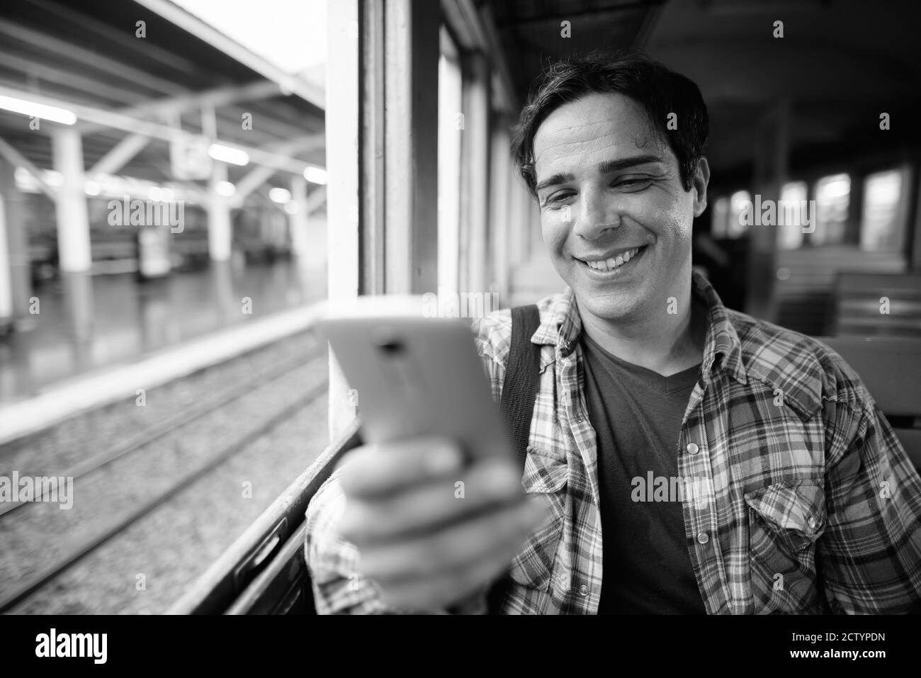 Portrait of handsome Persian tourist man at the railway station Stock Photo