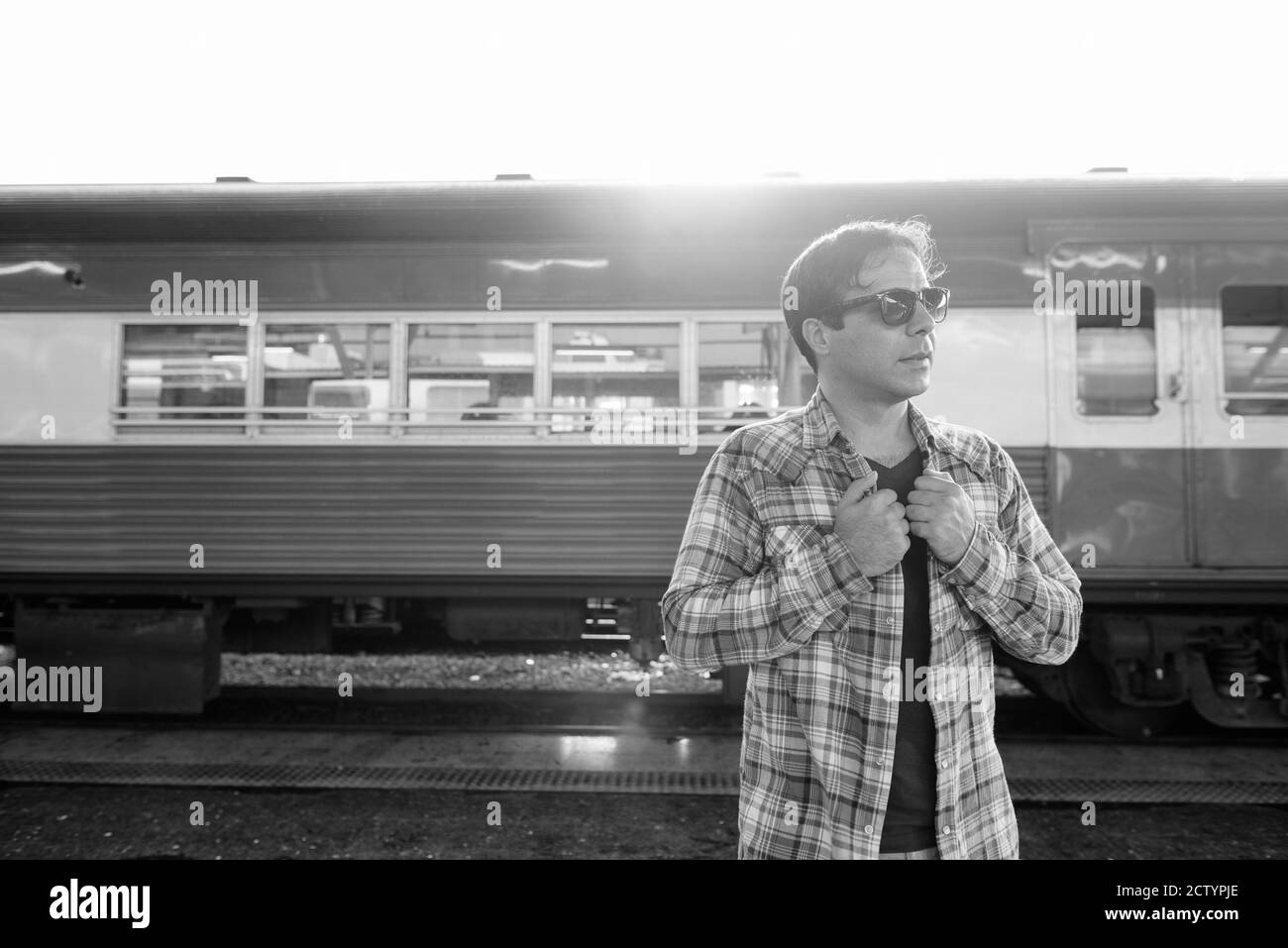 Portrait of handsome Persian tourist man at the railway station Stock Photo