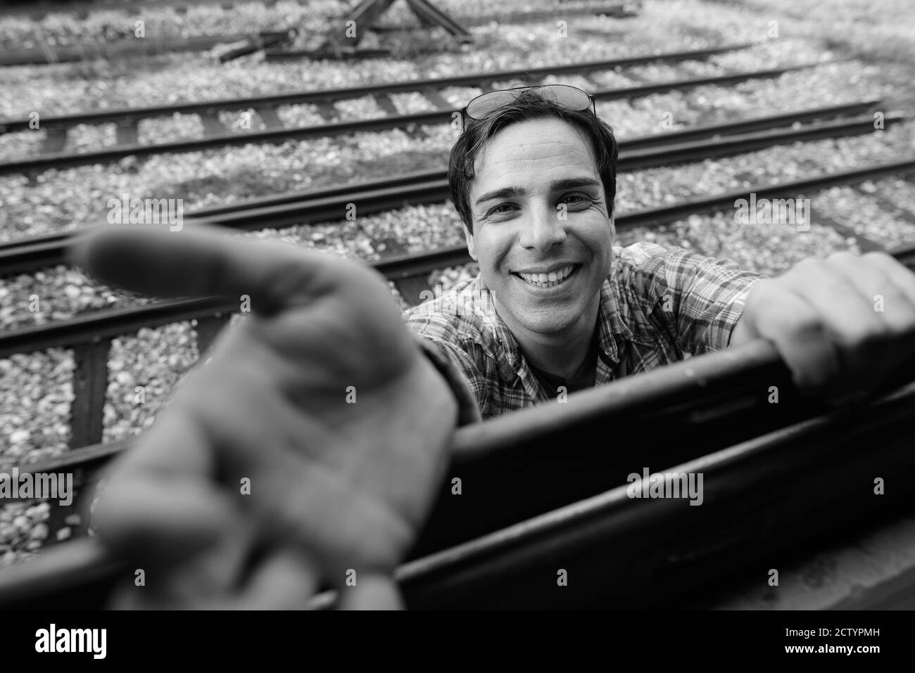 Portrait of handsome Persian tourist man at the railway station Stock Photo