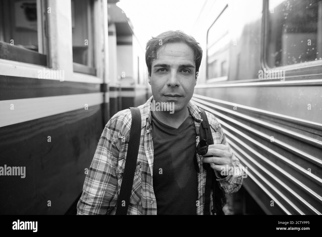 Portrait of handsome Persian tourist man at the railway station Stock Photo