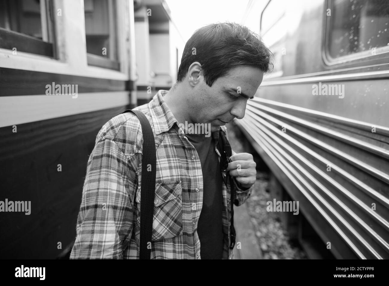 Portrait of handsome Persian tourist man at the railway station Stock Photo