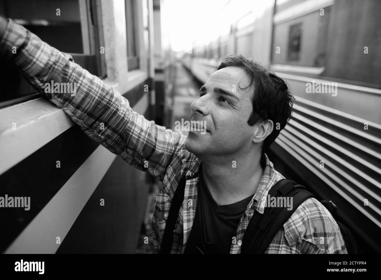 Portrait of handsome Persian tourist man at the railway station Stock Photo