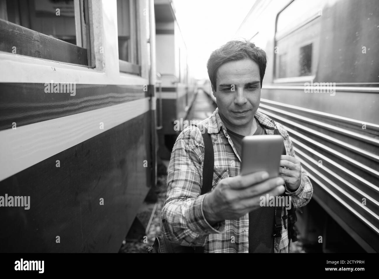 Portrait of handsome Persian tourist man at the railway station Stock Photo