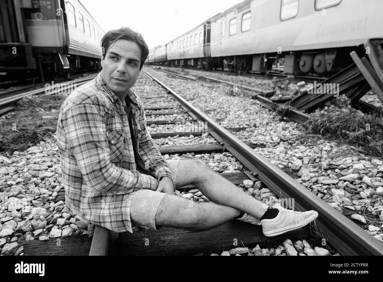 Portrait of handsome Persian tourist man at the railway station Stock Photo