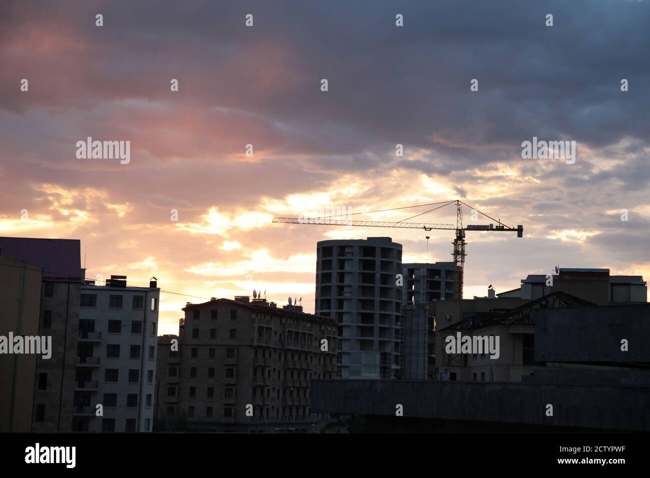 sky at sunset over the buildings in the city Stock Photo - Alamy