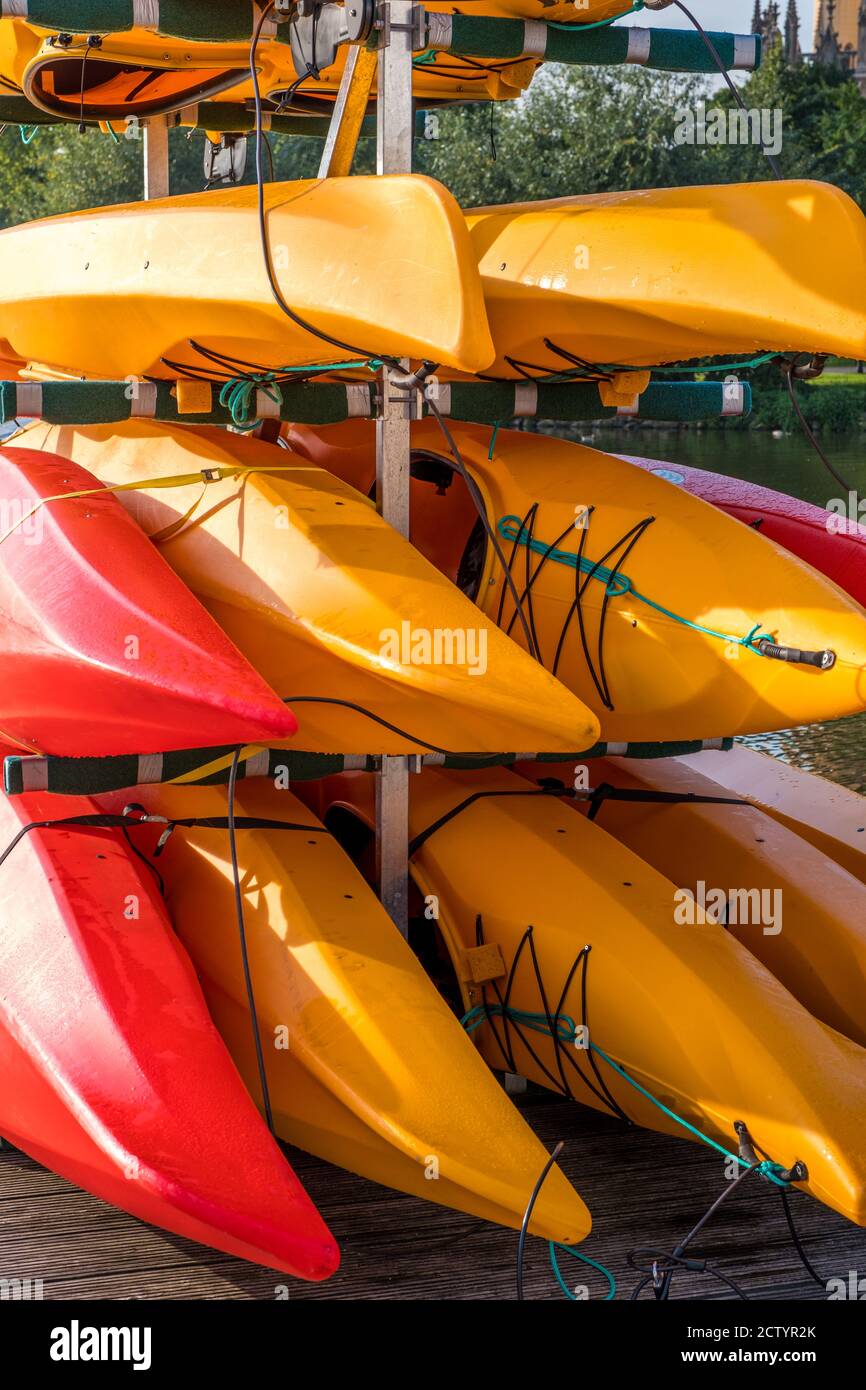 Colorful kayaks on the lake outdoor on a summer day Stock Photo