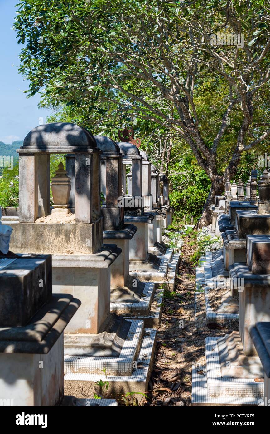 Limau-Limauan, Sabah, Malaysia: Suluk-Bajau tombs with their conspicious stone baldachins at the old islam cemetery of Limau-Limauan Stock Photo