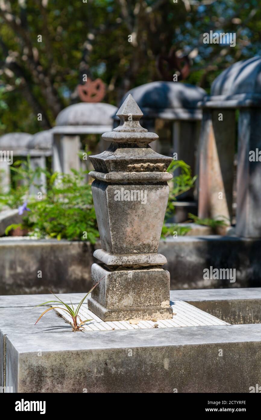 Limau-Limauan, Sabah, Malaysia: Suluk-Bajau tombs with their conspicious stone baldachins at the old islam cemetery of Limau-Limauan Stock Photo