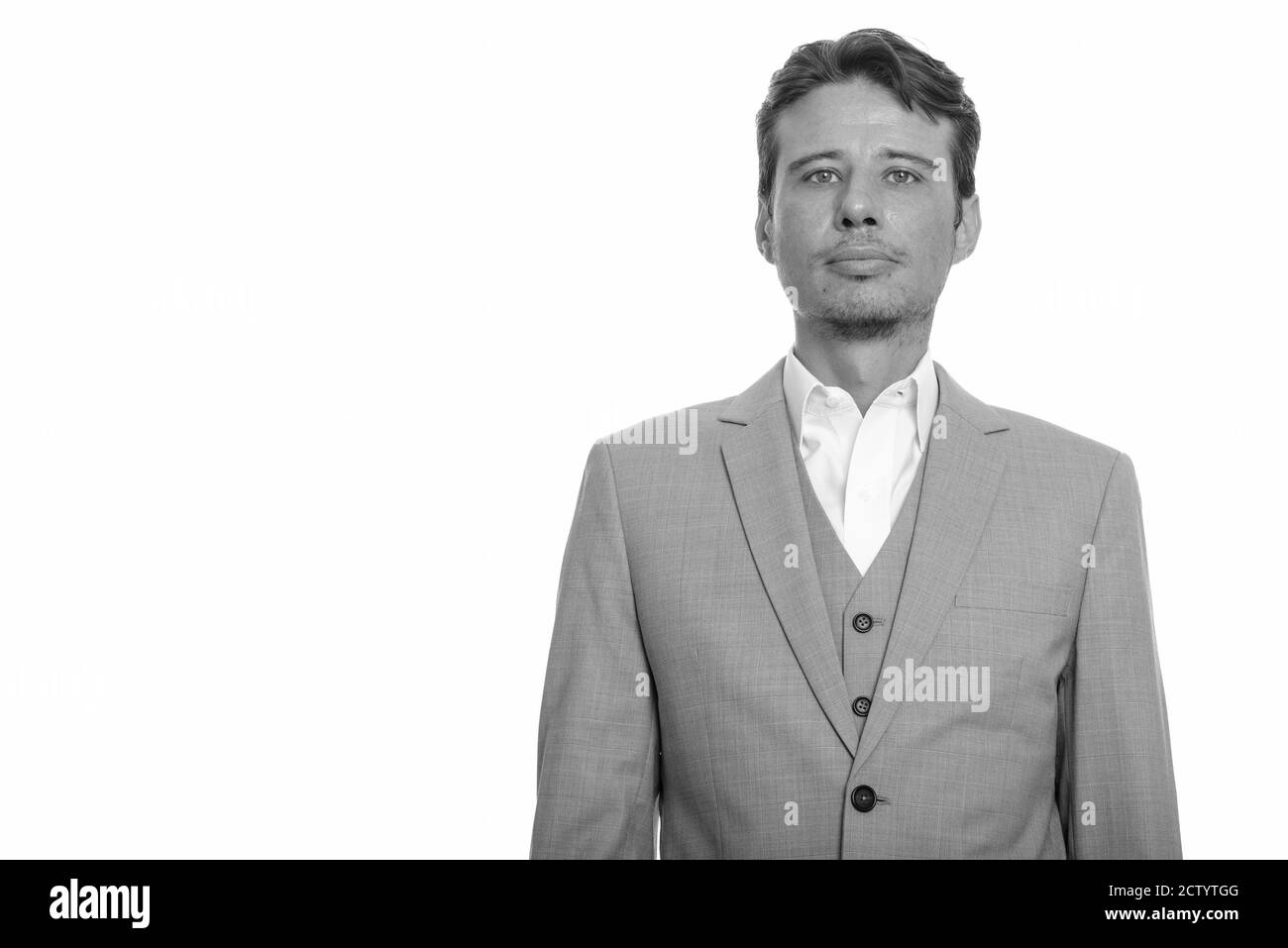 Portrait of handsome businessman in suit looking at camera Stock Photo ...