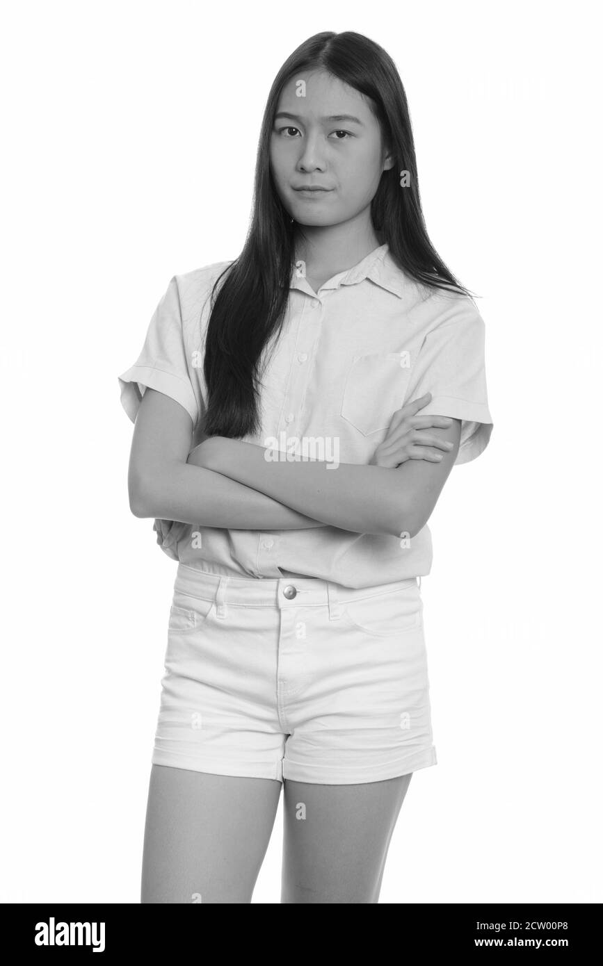 Portrait of young beautiful Asian teenage girl with arms crossed Stock Photo