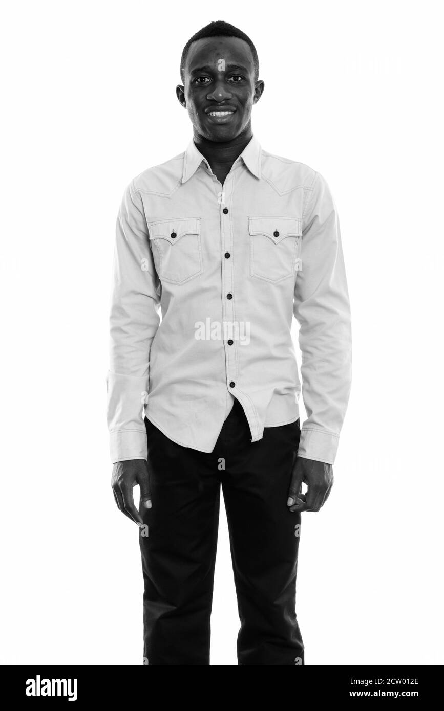 Happy young african man standing Black and White Stock Photos & Images ...