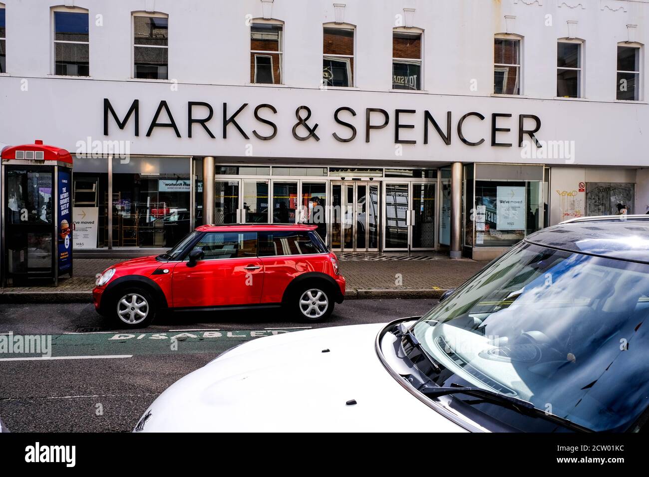 Red Mini Car Parked Outside High Street Retail Chain Marks And Spencer Marks And Spencer Stock