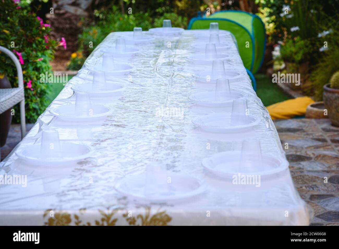 Table setting with plastic ware for summer picnic outdoor Stock Photo