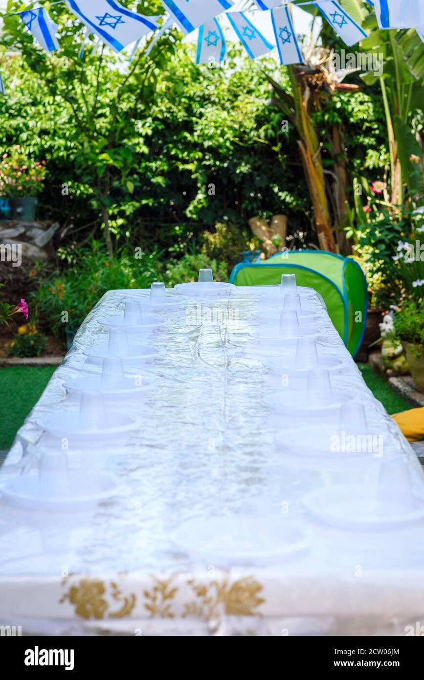 Table setting with plastic ware for summer picnic outdoor Stock Photo