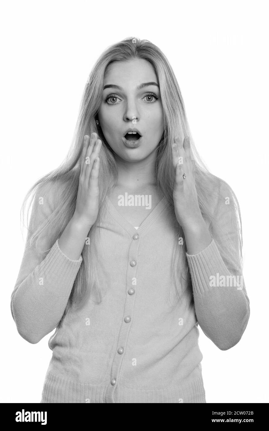 Studio shot of young beautiful teenage girl looking shocked Stock Photo ...
