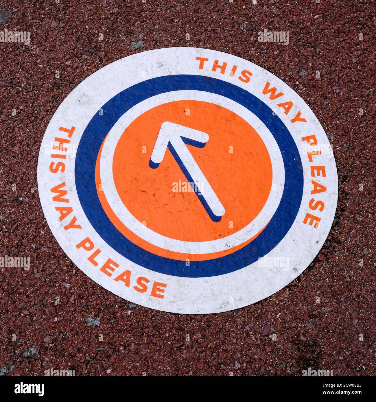 Round Direction Floor Sticker Keeping People Safe COVID-19, CLose Up No People Stock Photo
