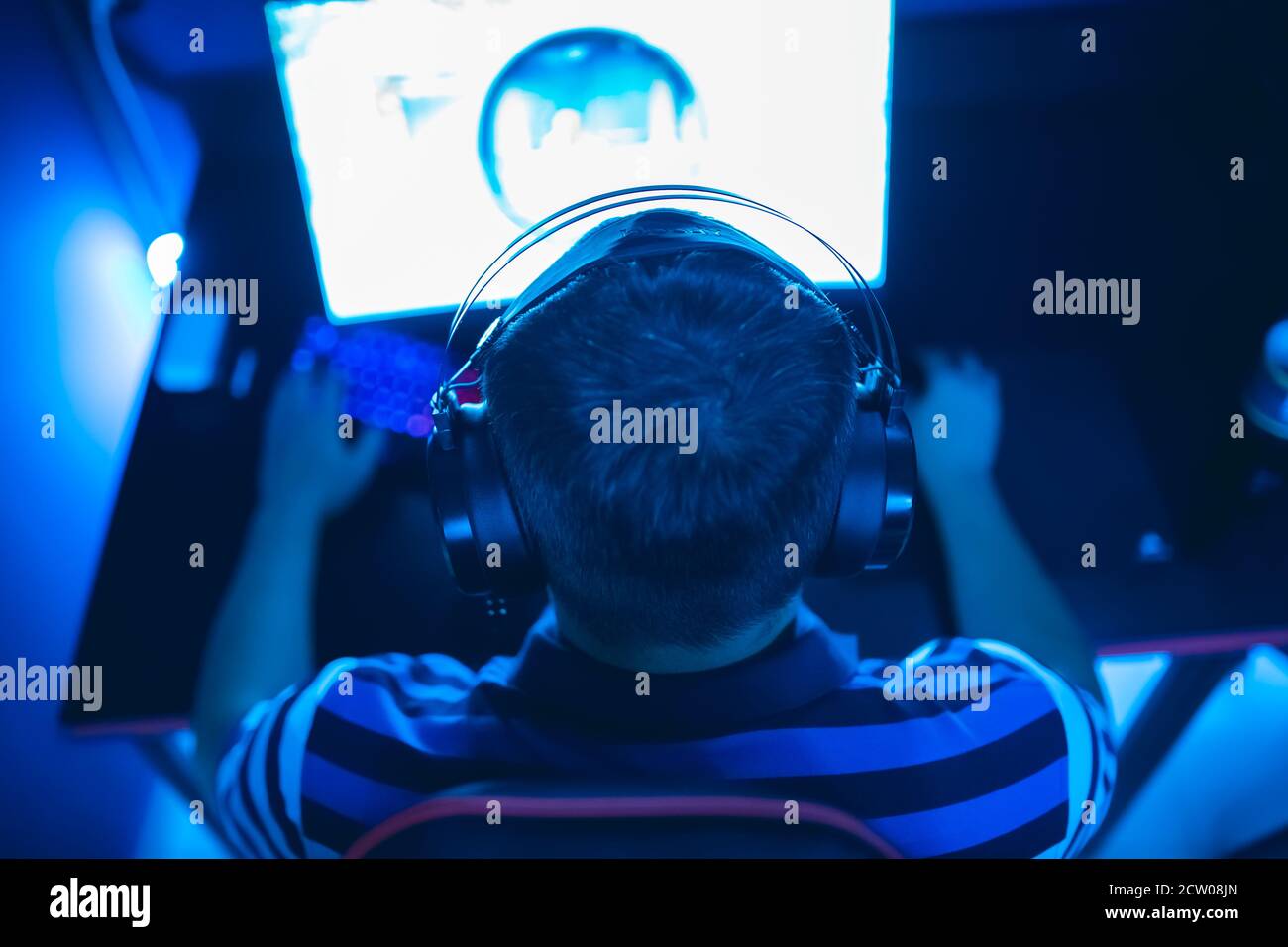 Professional gamer playing online games tournaments pc computer with