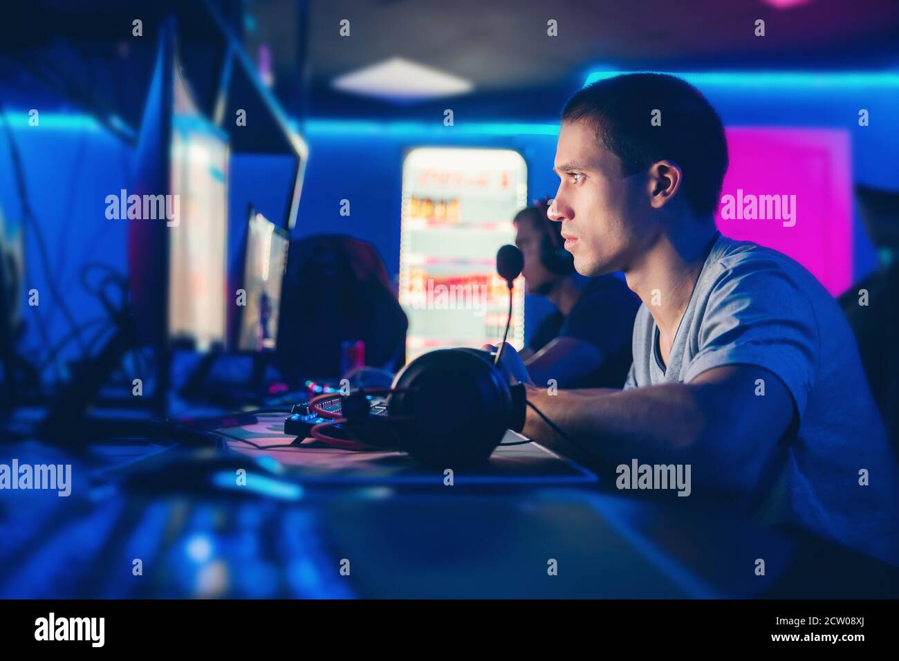 Professional cyber gamer playing online tournaments computer with ...