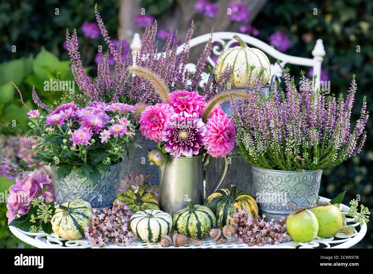 vintage decoration with bouquet of pink dahlias and autumn flowers Stock Photo