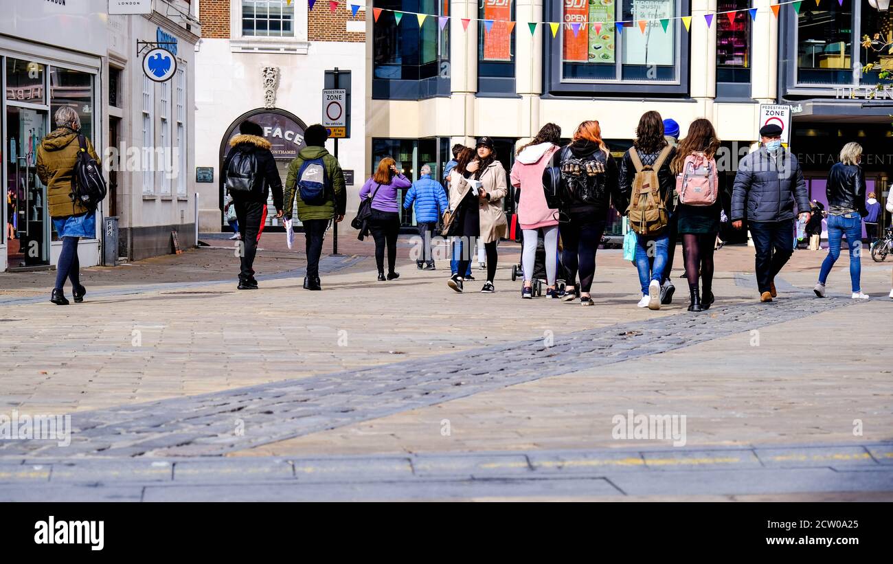 Groups Of People And Students Walking On High Street, COVID-19 Coronavirus Pandemic Stock Photo