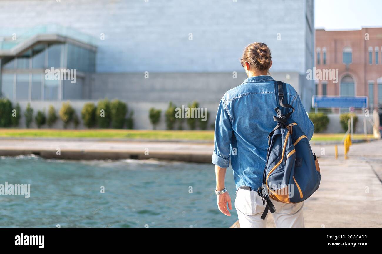 Guy long hair backpack walking hi-res stock photography and images - Alamy