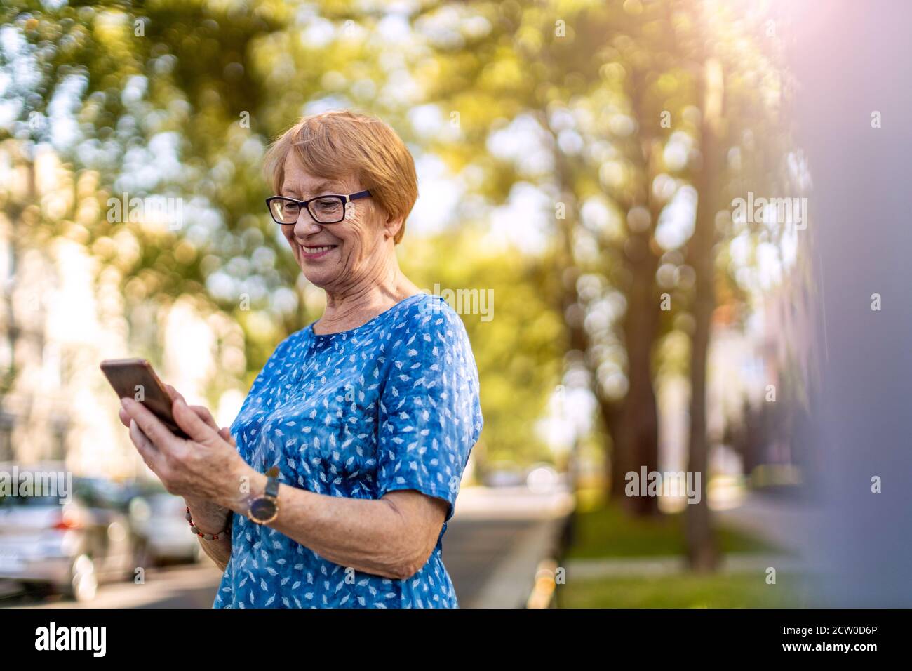 Happy mature woman calling hi-res stock photography and images - Alamy