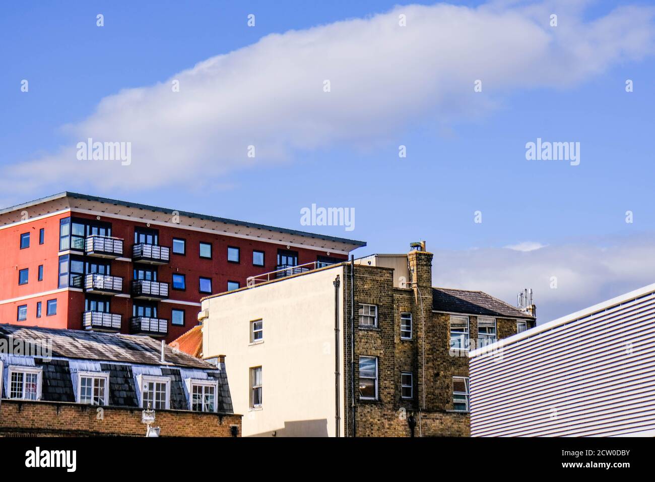 Mixture of Old And New Town Centre Buildings And Architecture Against A Blue Summer Sky With No People Stock Photo