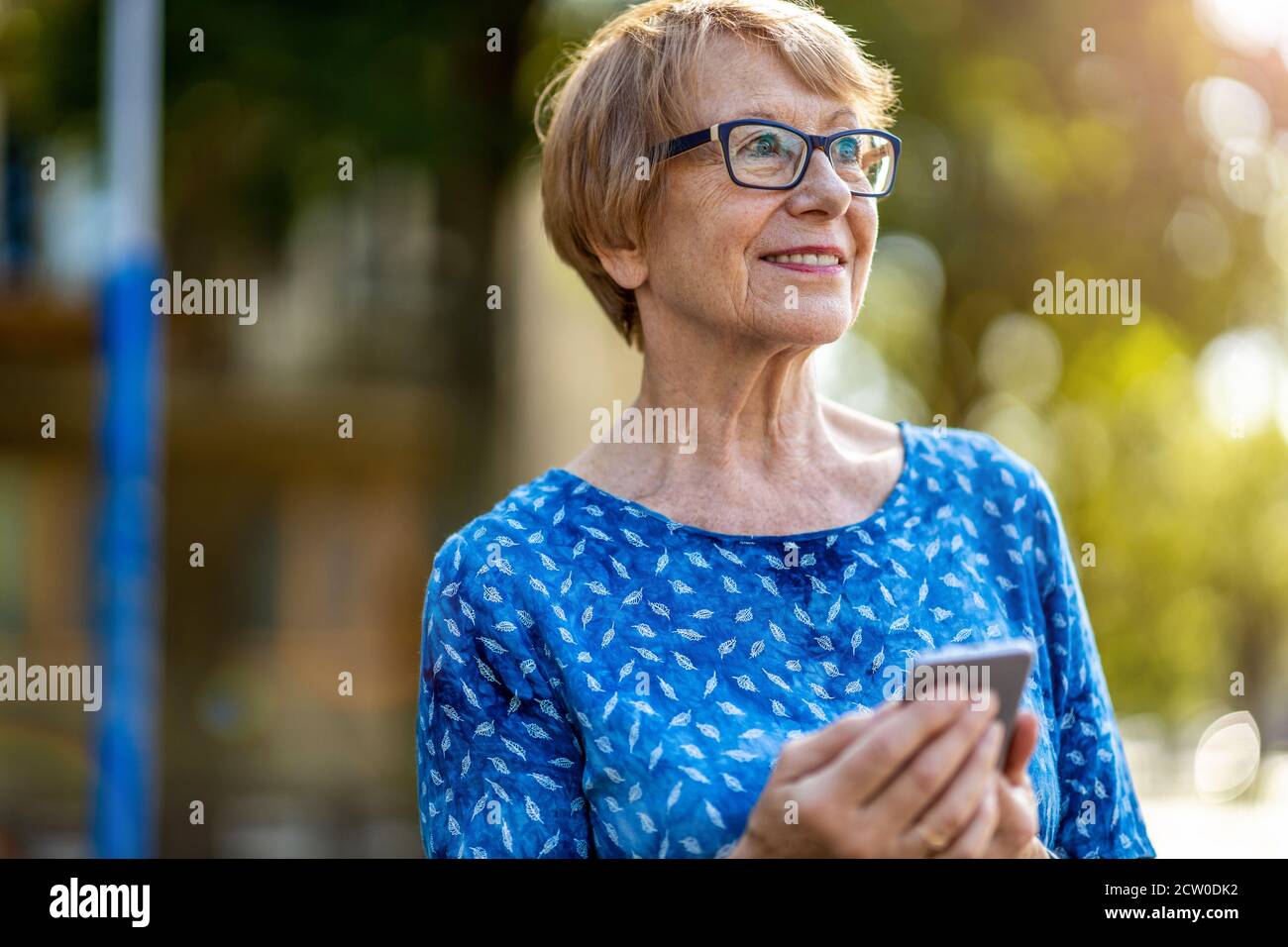 Happy mature woman calling hi-res stock photography and images - Alamy