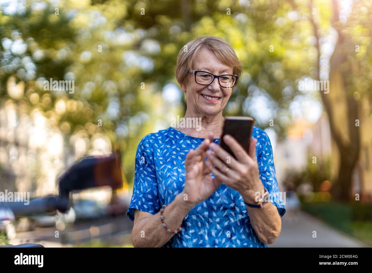 Happy mature woman calling hi-res stock photography and images - Alamy