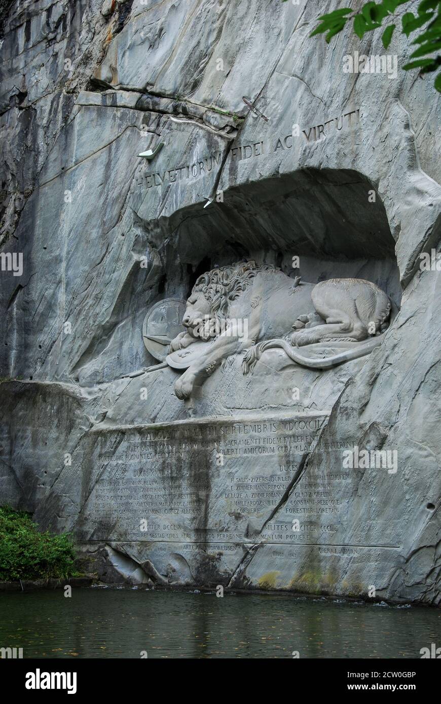 The Lion Monument or the Lion of Lucerne, a giant dying lion carved out of a wall of sandstone rock Stock Photo
