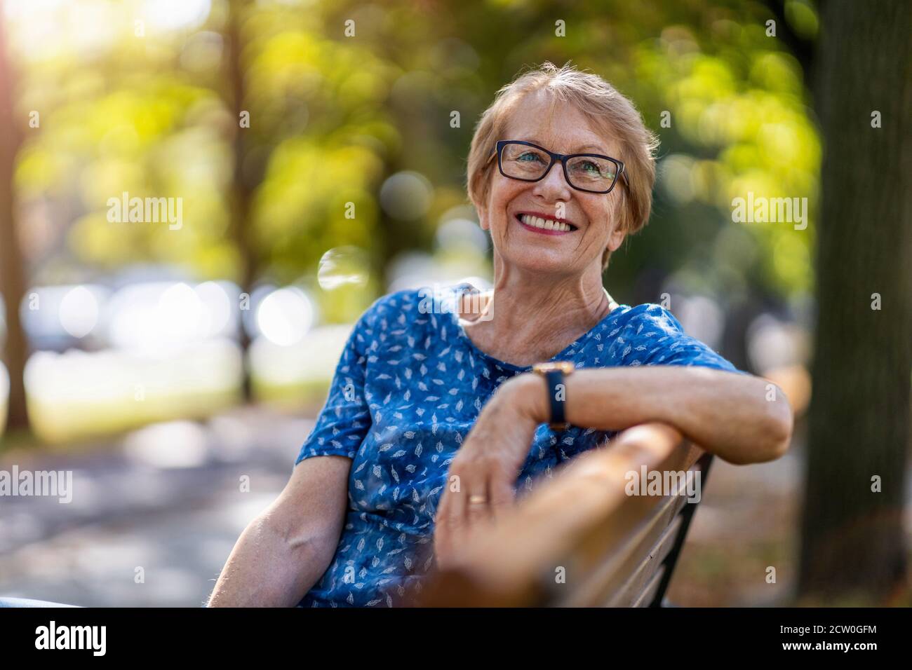 Happy senior woman enjoying a day outdoors Stock Photo