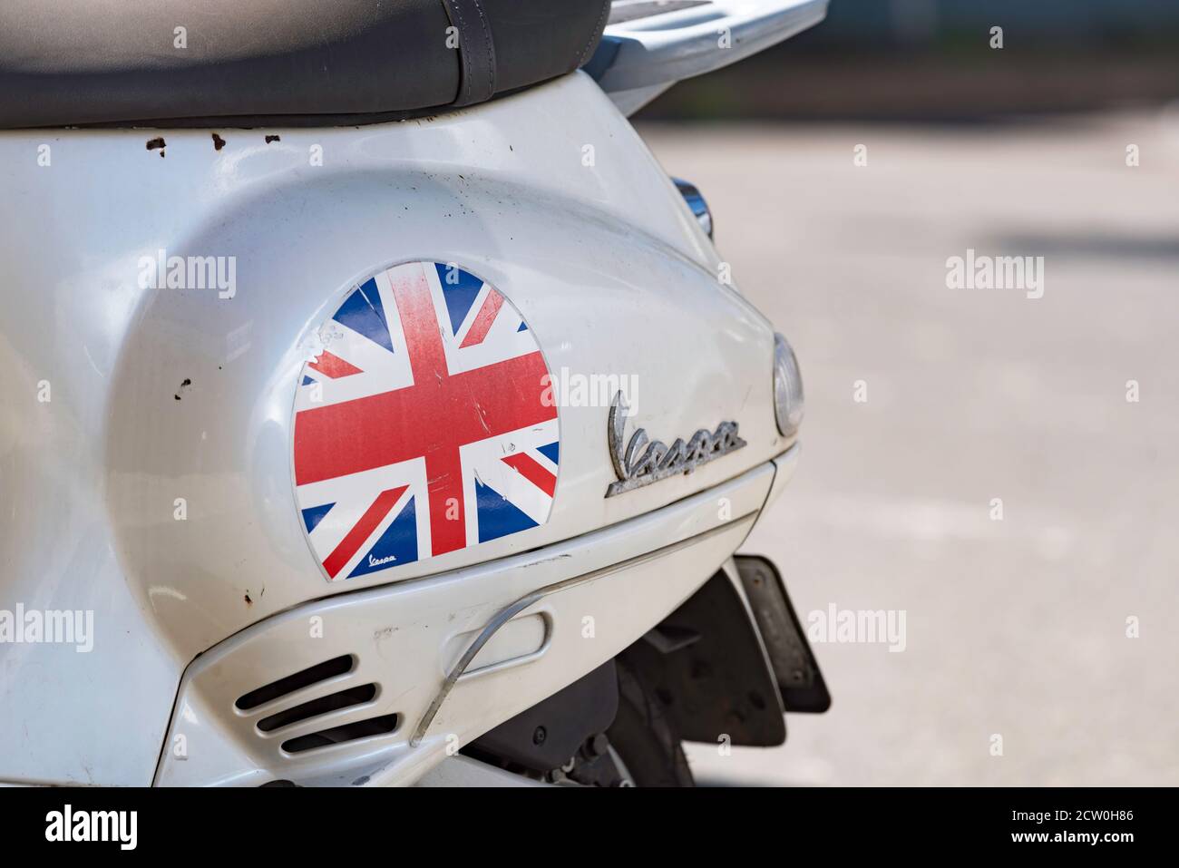 A slightly faded Union Jack sticker or decal on the rear wheel mudguard of a Vespa motor scooter in Sydney, Australia Stock Photo