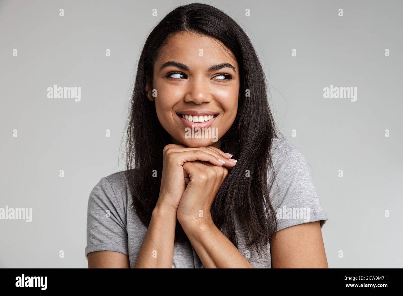 Portrait of a happy smiling young african woman with long dark hair ...