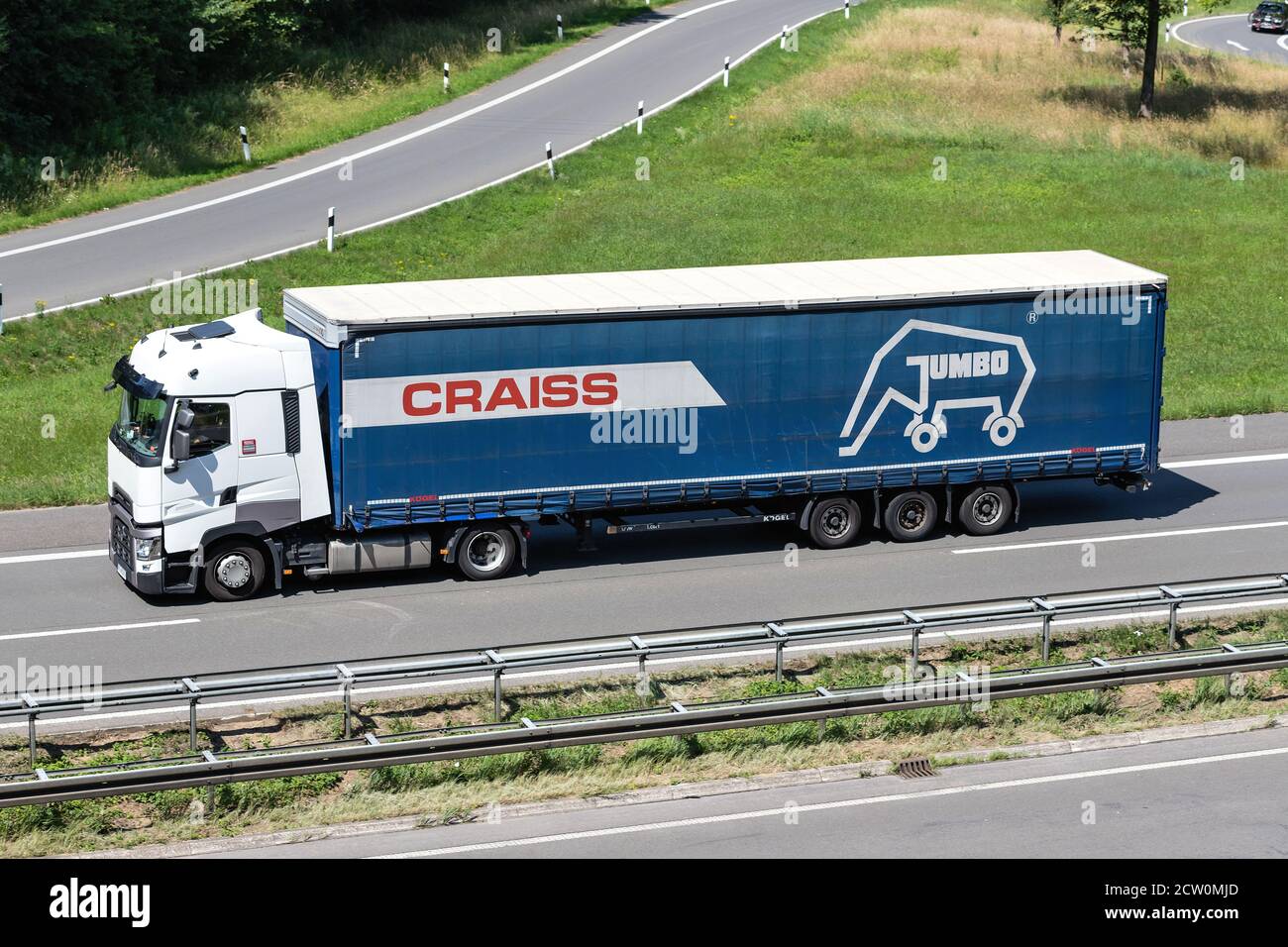 Renault truck with Craiss curtainside trailer on motorway. Stock Photo