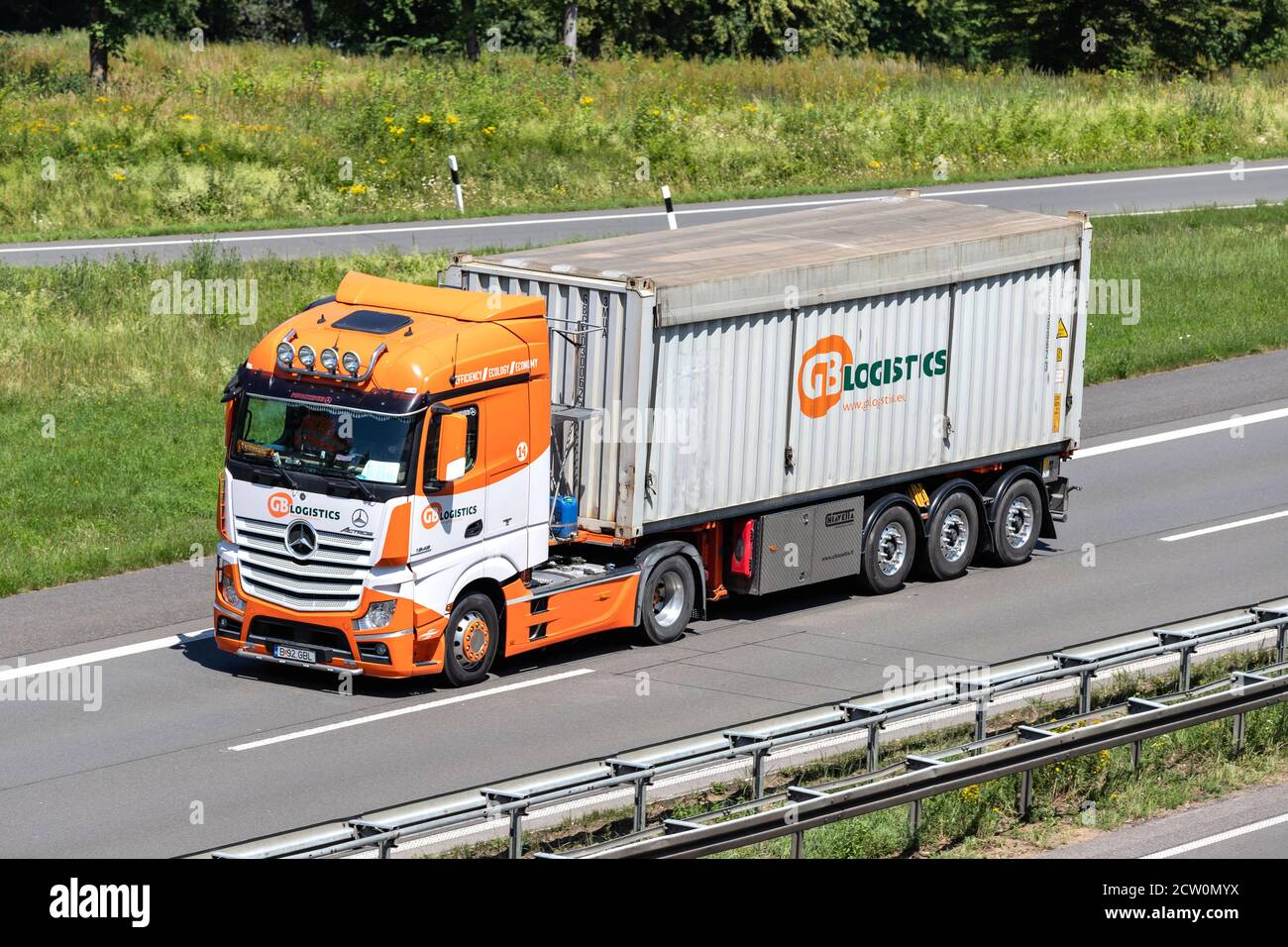 GB Logistics Mercedes-Benz Actros truck with bulk container on motorway. Stock Photo