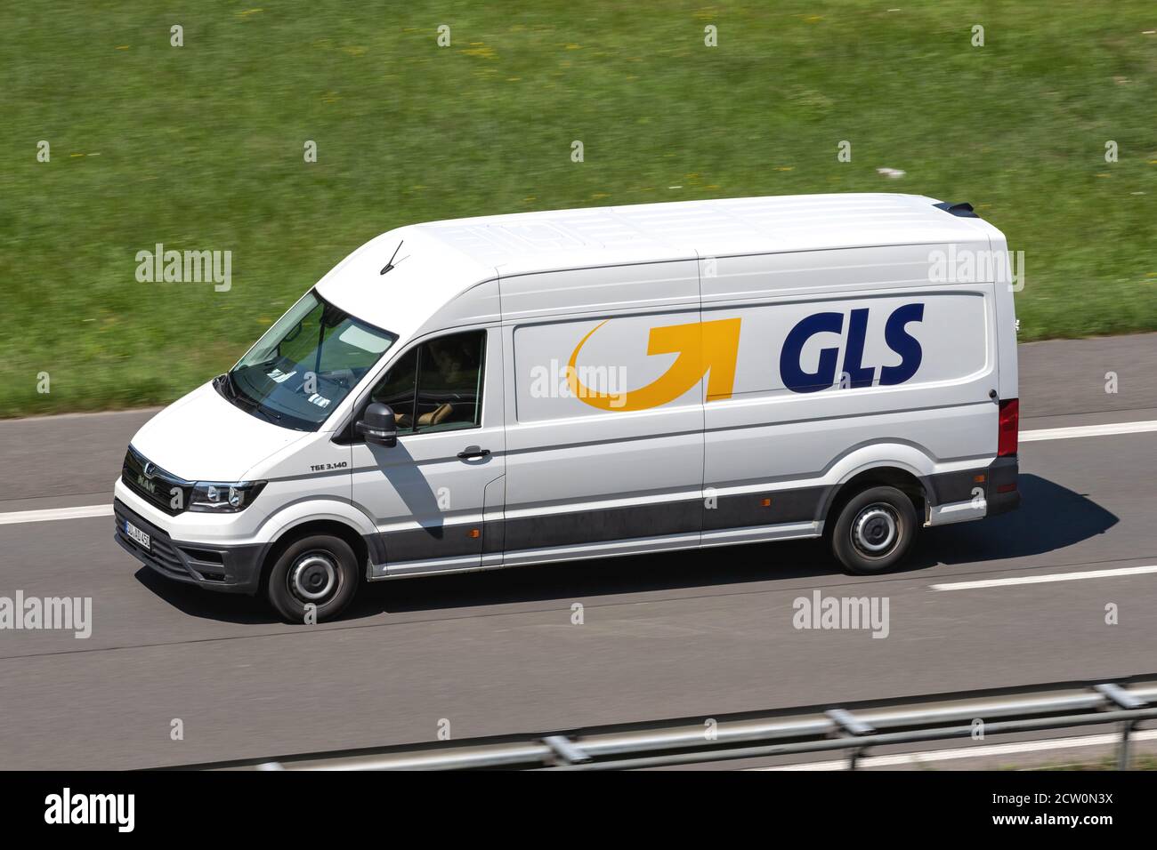GLS MAN TGE delivery van on motorway. General Logistics Systems B.V. was founded in 1999 and is a subsidiary of British postal service Royal Mail. Stock Photo