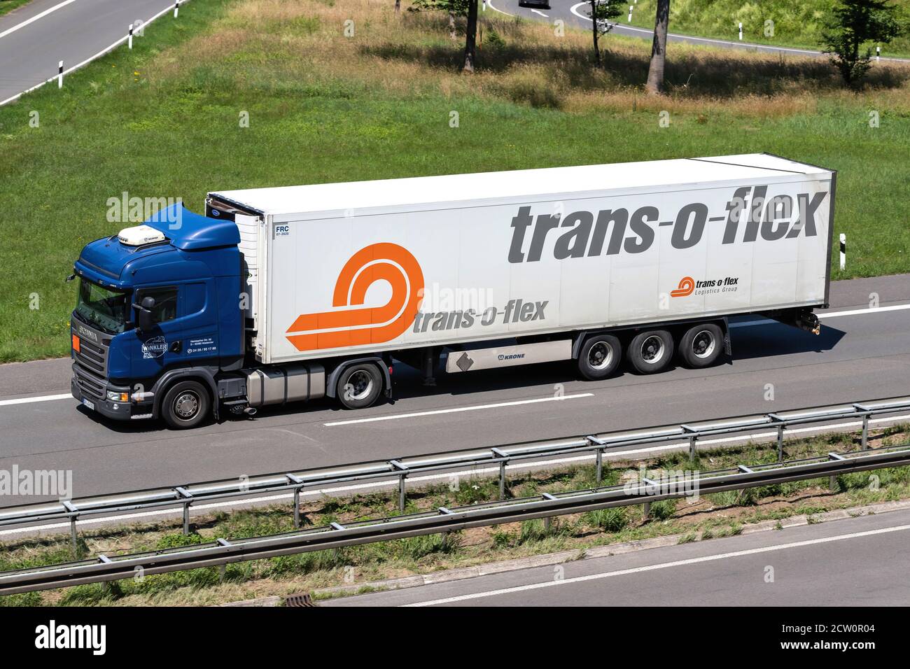 Winkler Scania R410 truck with temperature controlled trans-o-flex trailer on motorway. Stock Photo