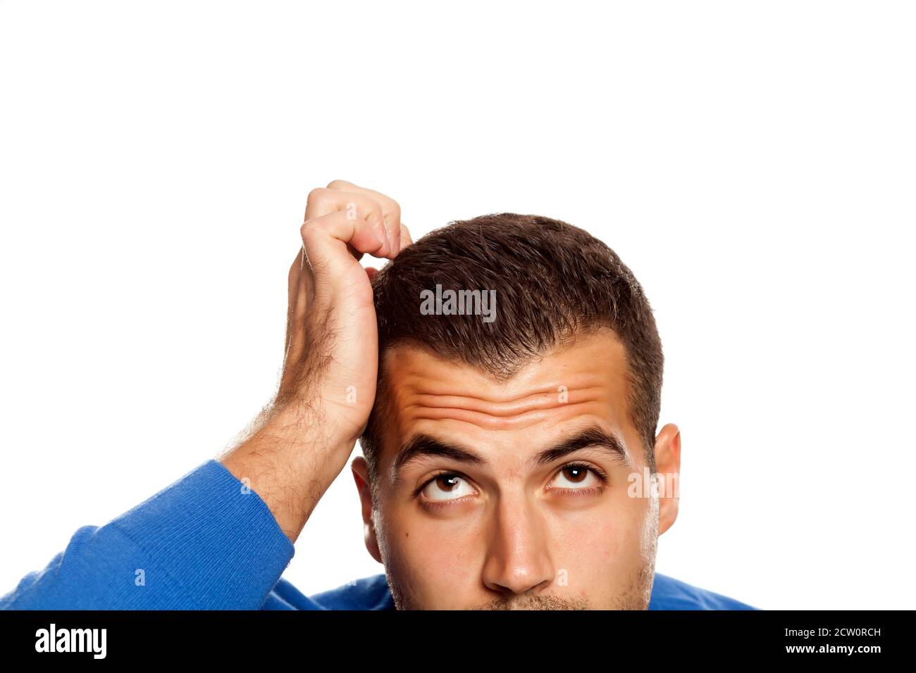 Half Portrait Of Young Confused Man On White Background Stock Photo Alamy half-portrait-of-young-confused-man-on-white-background-stock-photo-alamy