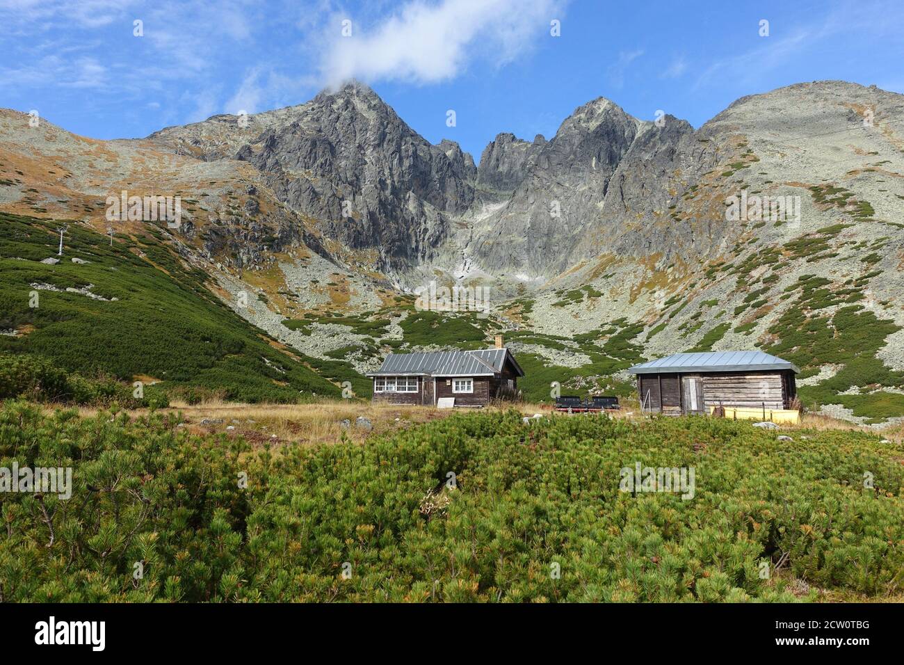 Lomnicky Stit with blue sky, observatory hidden behind clouds, High Tatras wallpaper, Slovakia Stock Photo